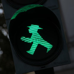 Low angle view of illuminated road sign