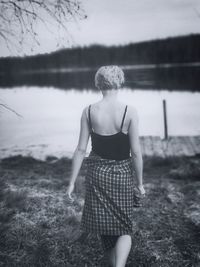 Full length of woman standing on field