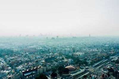 High angle view of buildings in city against sky