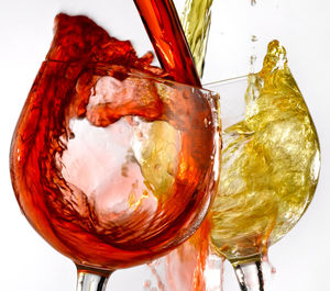 Close-up of beer glass against white background