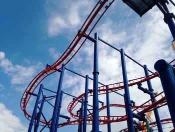 Low angle view of rollercoaster against sky