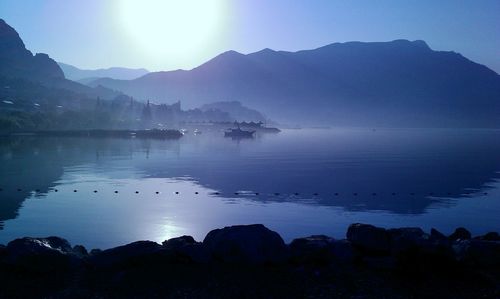 Scenic view of lake against sky during sunset