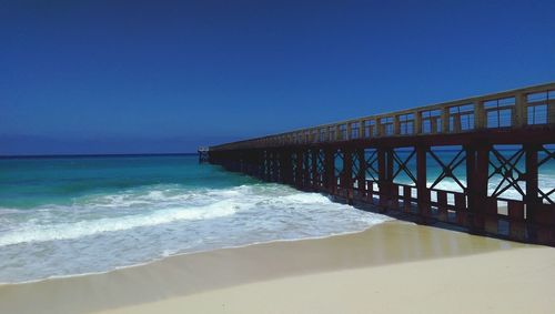 View of sea against clear blue sky