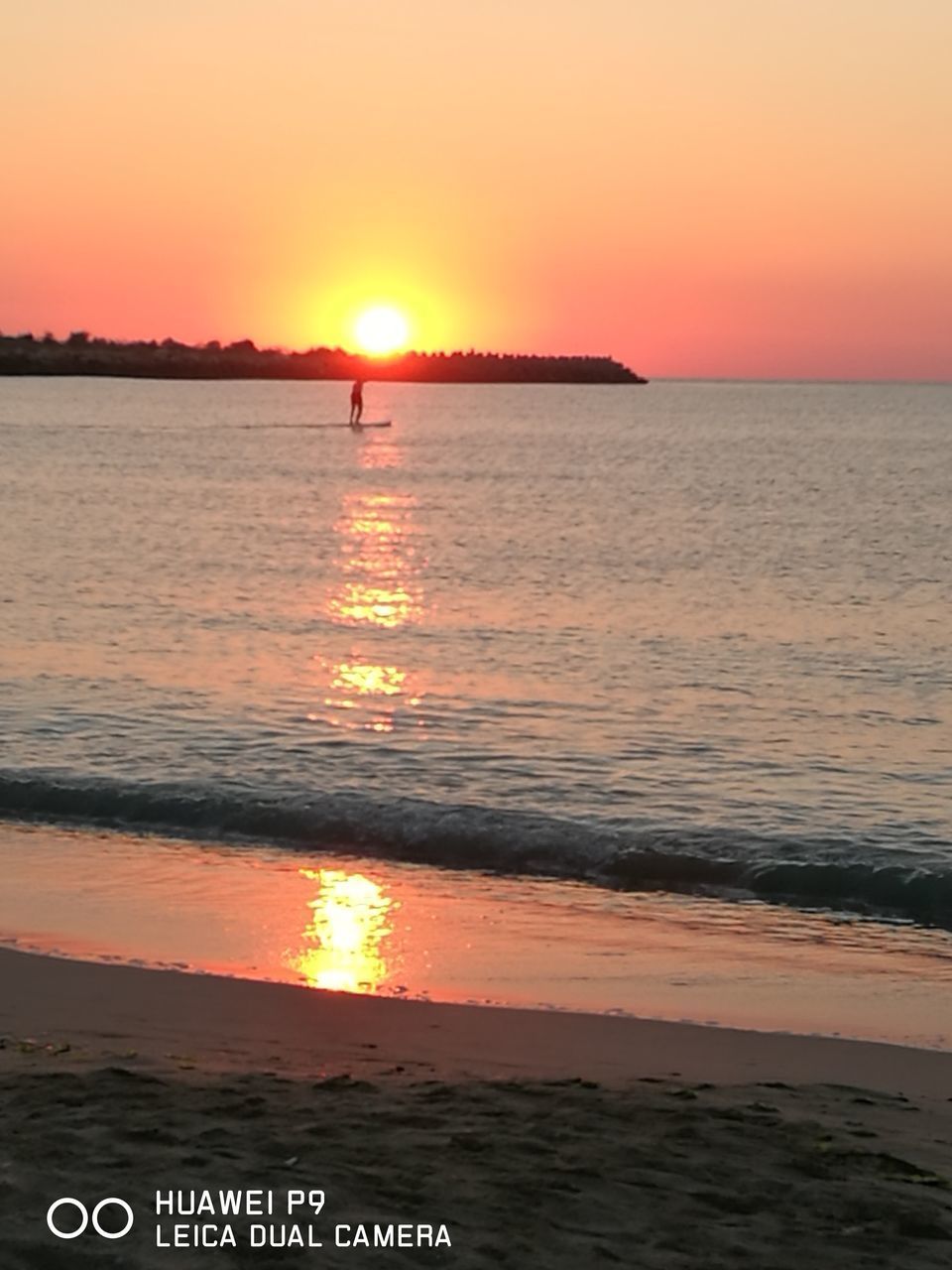 SCENIC VIEW OF SEA AT SUNSET