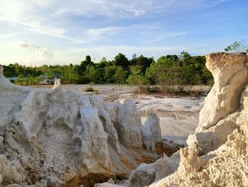 Scenic view of waterfall against sky