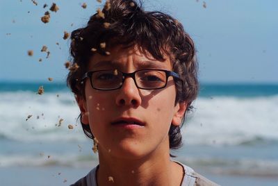 Close-up portrait of boy at beach