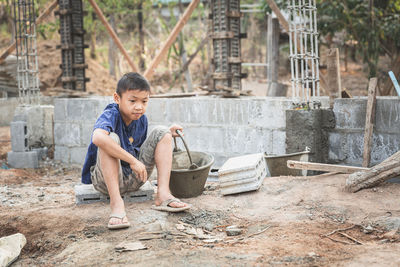 Concept of poverty and child labor, children who are working on construction sites .