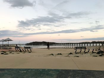 Scenic view of beach against sky during sunset