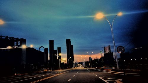View of cityscape against cloudy sky