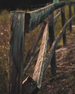 Close-up of wooden fence on field