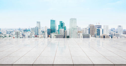 Modern buildings in city against sky