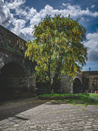View of old building against cloudy sky