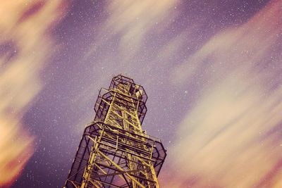 Low angle view of ferris wheel against sky at night