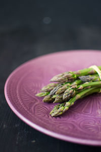 Close-up of food on table against black background