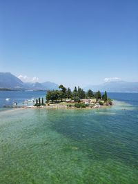Scenic view of sea against clear blue sky