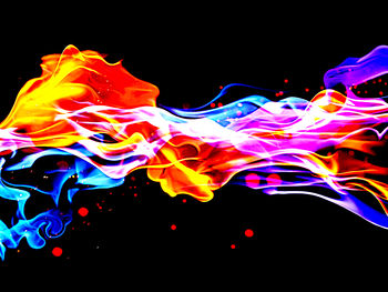 Colorful light painting against black background