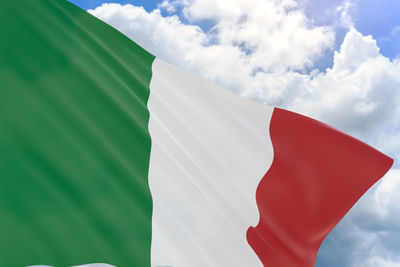 Low angle view of italian flag against sky