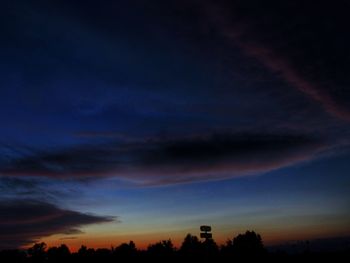 Silhouette trees against dramatic sky