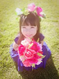 Portrait of cute girl with pink flowers