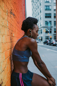 Woman exercising in city