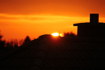 Silhouette of building at sunset