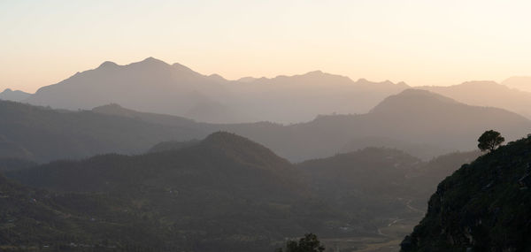 Scenic view of mountains against sky during sunset