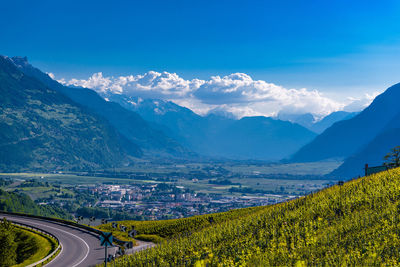 Scenic view of landscape and mountains against sky