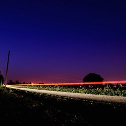 Road against sky at night