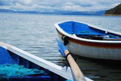 Boats moored in sea