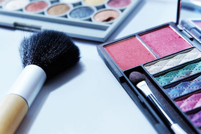 Close-up of make-up on table