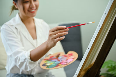 Young woman writing in book