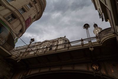 Low angle view of building against cloudy sky