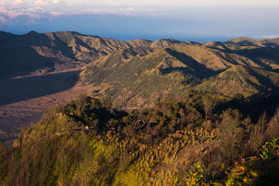 Scenic view of landscape and mountains against sky