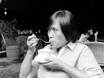 Portrait of woman drinking drink