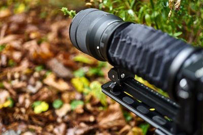 Bellows unit on adjustment slide with zoom lens, selective focus on lens, narrow depth of field