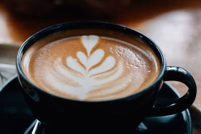 Close-up of cappuccino on table