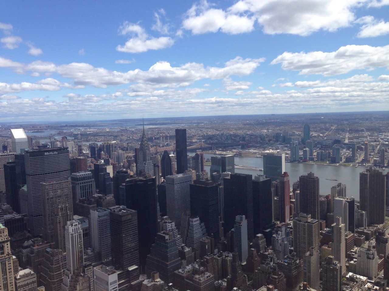 cityscape, city, building exterior, architecture, built structure, skyscraper, crowded, sky, tower, modern, tall - high, high angle view, aerial view, cloud - sky, capital cities, office building, travel destinations, financial district, famous place, international landmark