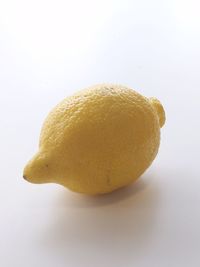 Close-up of lemon slice against white background