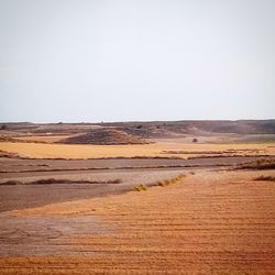 Scenic view of desert against clear sky