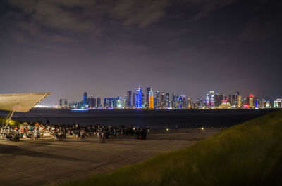 Illuminated cityscape seen from museum of islamic art at night