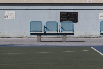 Empty chairs against the wall