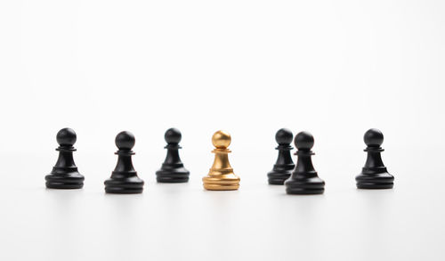 Row of chess board against white background
