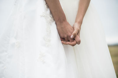 Brides holding hands