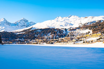 The town and lake of santk moritz in winter. engadin, switzerland.