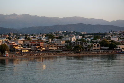 Cityscape at sunset, agioi apostoli, chania, crete, greece.