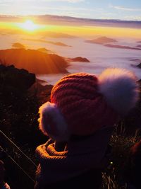 Woman against sky at sunset