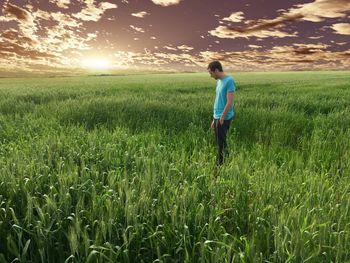 Full length of man standing on grassy field