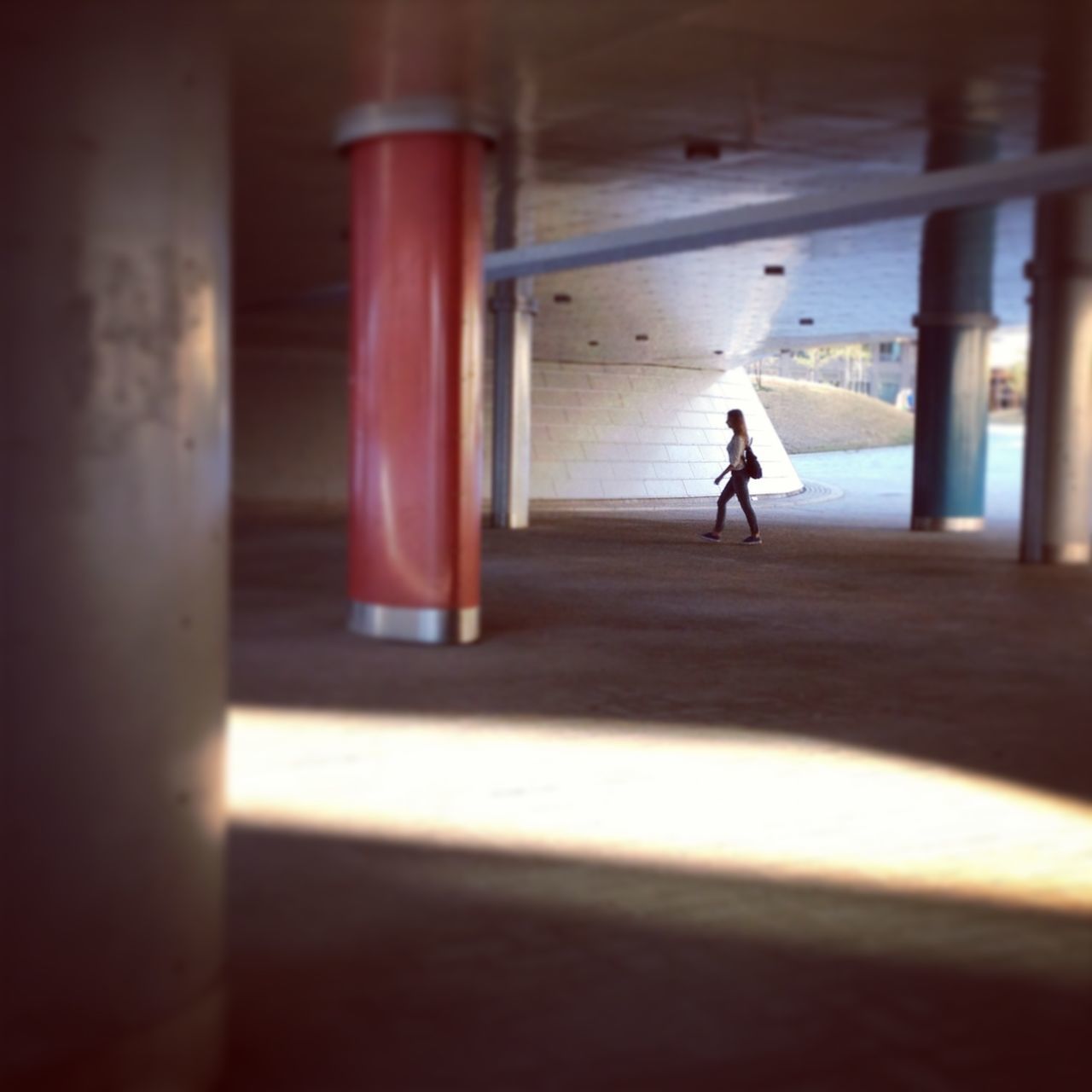 indoors, lifestyles, full length, walking, leisure activity, men, rear view, flooring, person, architecture, built structure, silhouette, standing, shadow, corridor, day, sunlight, side view