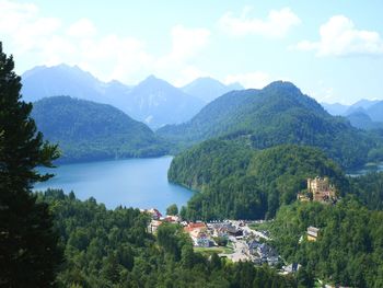 High angle view of townscape by mountains against sky