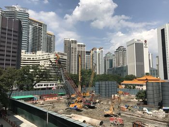 Modern buildings in city against sky